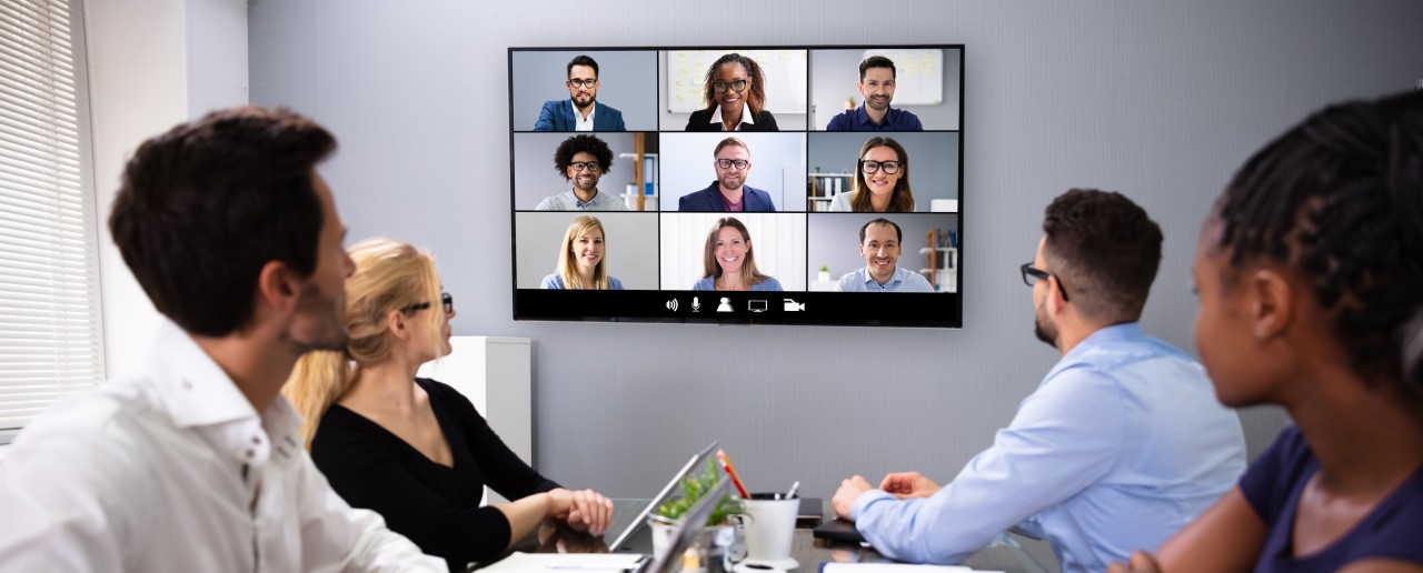 A group of people having a remote meeting.