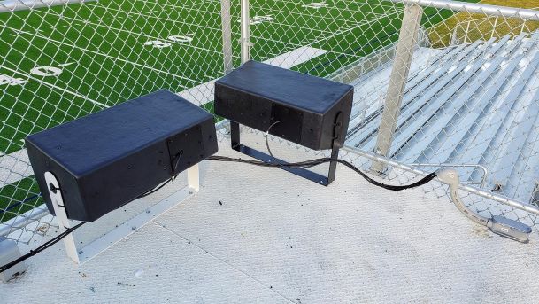 Speakers in a football field