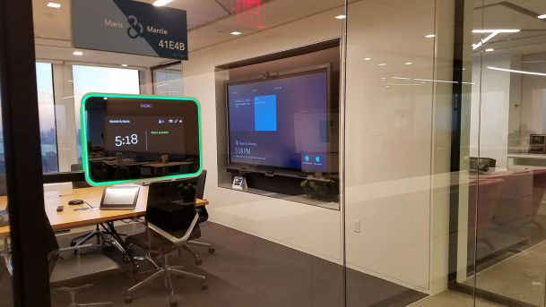 Conference room viewed from outside with a touch control panel